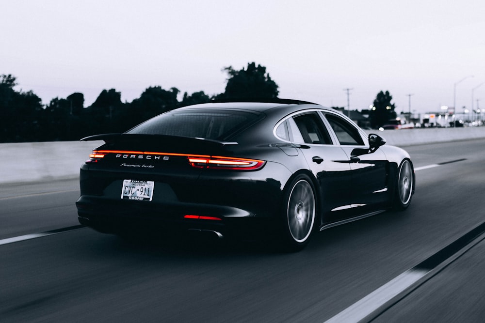 Dark saloon at speed on a highway