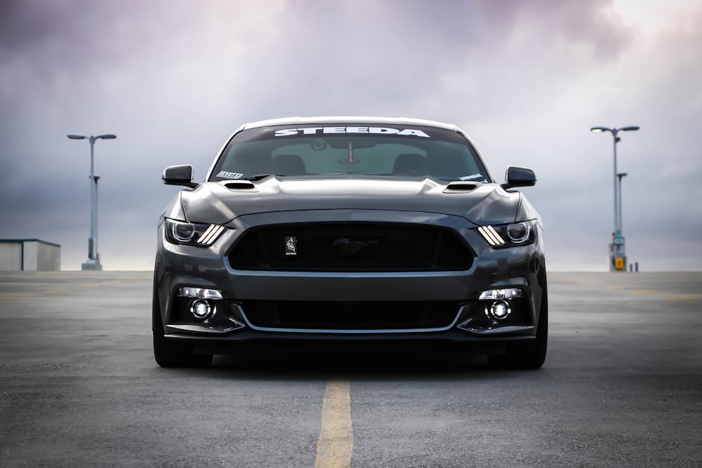 Muscle car head-on under a heavy sky